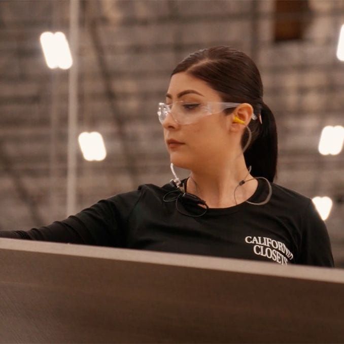 Engineer in San Francisco facility creating boards for home storage systems from California Closets